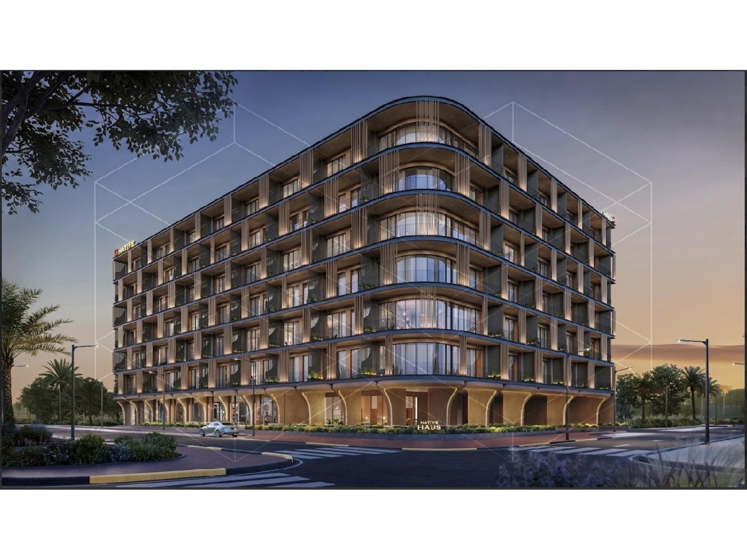 Native Haus building facade at dusk in Jumeirah Village Triangle, Dubai